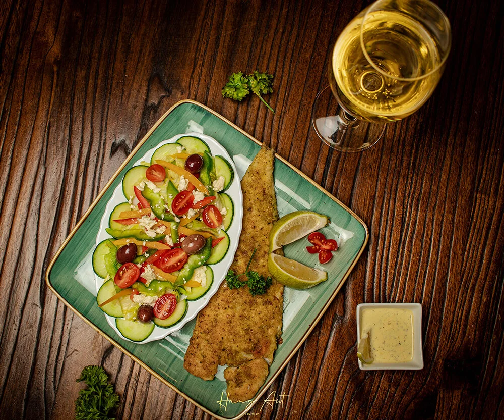 Hang Awt plated meal with salad and sides